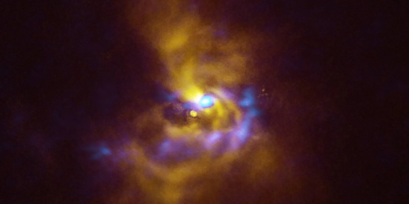 Spiral structures around the eruptive young star V960 Mon
